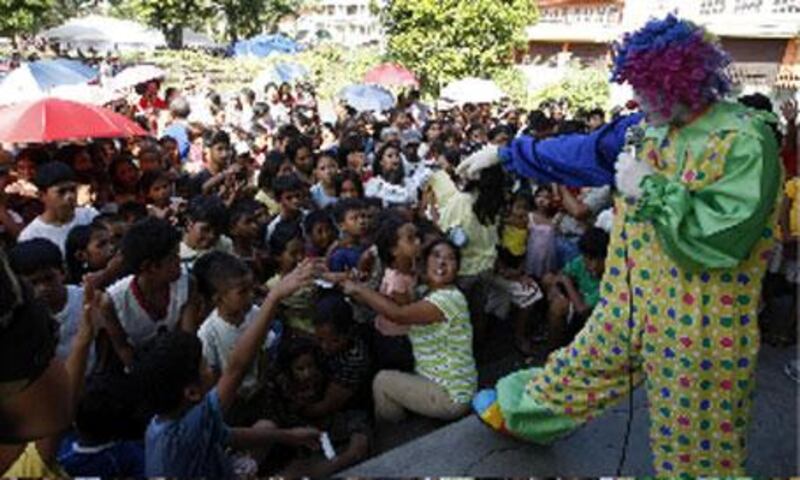 Mayon volcano evacuees are entertained by a clown at a public school turned into an evacuation centre in Legazpi City today.