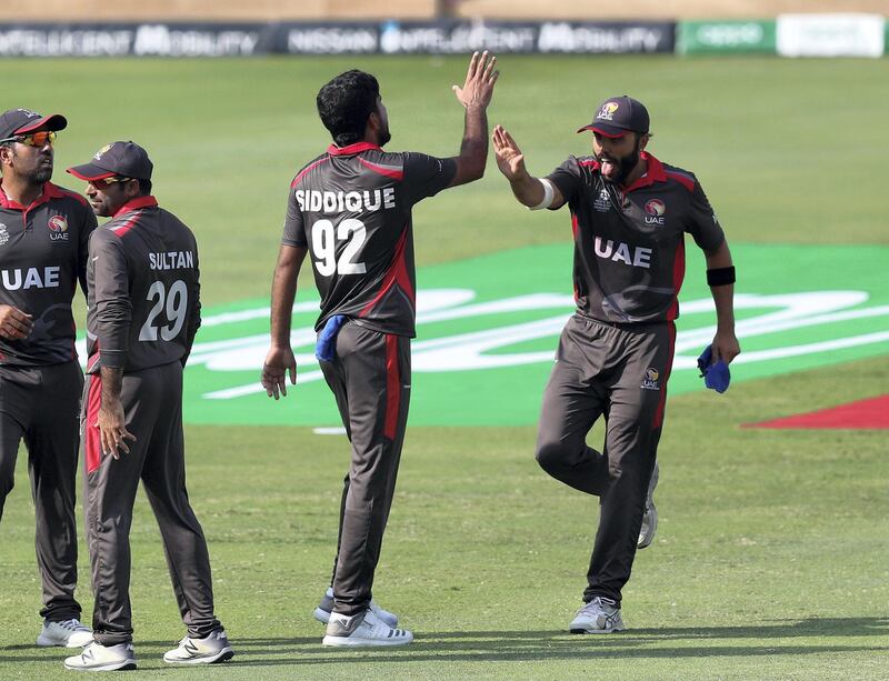 Dubai, United Arab Emirates - October 30, 2019: Junaid Siddique of the UAE takes the wicket of Kyle Coetzer of Scotland during the game between the UAE and Scotland in the World Cup Qualifier in the Dubai International Cricket Stadium. Wednesday the 30th of October 2019. Sports City, Dubai. Chris Whiteoak / The National