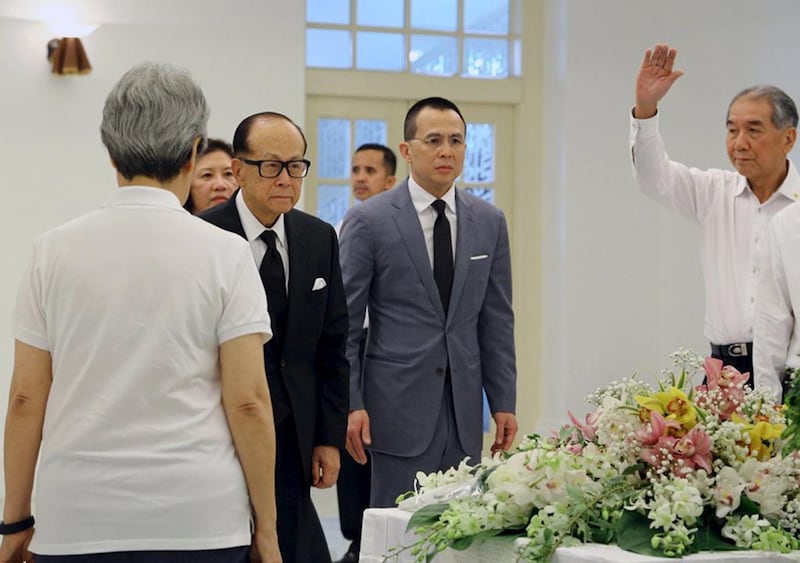 Hong Kong billionaire Li Ka Shing, second from left, pays his respects to the late former prime minister Lee Kuan Yew at the Istana in Singapore on March 23, 2015. Lee, Singapore's first prime minister and architect of the tiny Southeast Asian city-state's rapid rise from British colonial outpost to global trade and financial centre, died early on Monday. Ministry of Communications and Information of Singapore/Handout via Reuters 