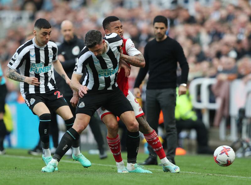 Newcastle's Fabian Schar clatters into Arsenal's Gabriel Jesus. Reuters