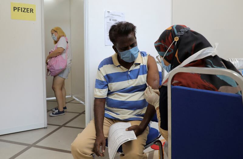 A man receives a booster dose of the Pfizer vaccine in Kuala Lumpur. Photo: Reuters