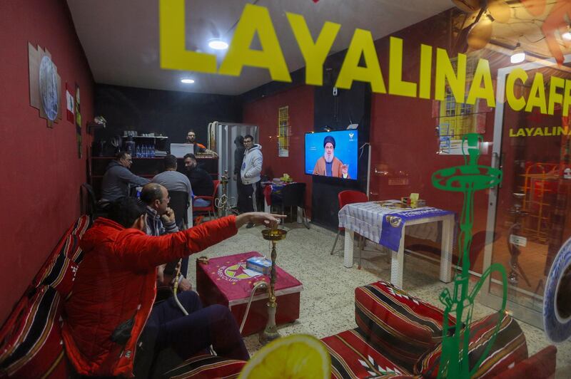 Lebanese citizens in a coffee shop watch Hassan Nasrallah address political developments in Lebanon and the situation after new government formed with three Hezbollah ministers. EPA