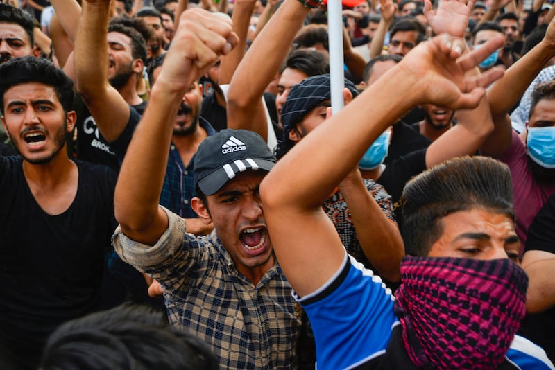 Demonstrators protest against state corruption, failing public services and unemployment in the central Iraqi shrine city of Najaf. AFP