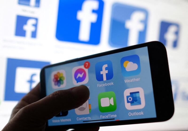(FILES) In this file photo taken on March 02, 2021 an illustration photo shows a Facebook App logo displayed on a smartphone in Los Angeles. Ireland's data regulator has launched an official inquiry into Facebook after data on 533 million users was leaked on a hacking website, a spokesman said April 14, 2021. / AFP / Chris DELMAS
