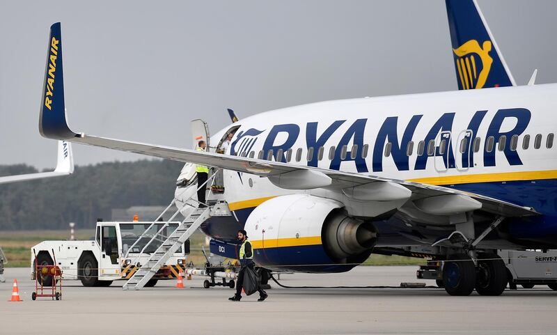 FILE - In this Wednesday, Sept. 12, 2018 file photo, a Ryanair jetplane parks at the airport in Weeze, Germany. Ryanair has sought to deflect criticism Friday, Oct. 26 about its handling of a racially charged dispute on one of its flights by releasing letters showing that it swiftly apologized to the victim and referred the matter to police. The move comes as the man who directed racial slurs at a fellow passenger denied being a racist and apologized to the woman he berated on a flight from Barcelona to London's Stansted Airport.
 (AP Photo/Martin Meissner, file)