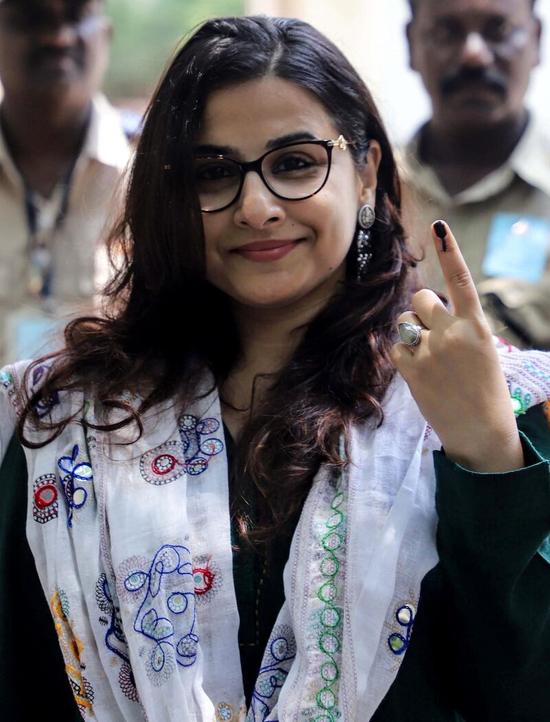 Bollywood actress Vidya Balan poses for photographs as she leaves a polling station after casting her vote in Mumbai on April 29, 2019.  AFP