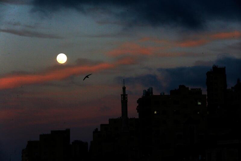 A view of the full moon shining over the West Bank city of Nablus.  EPA