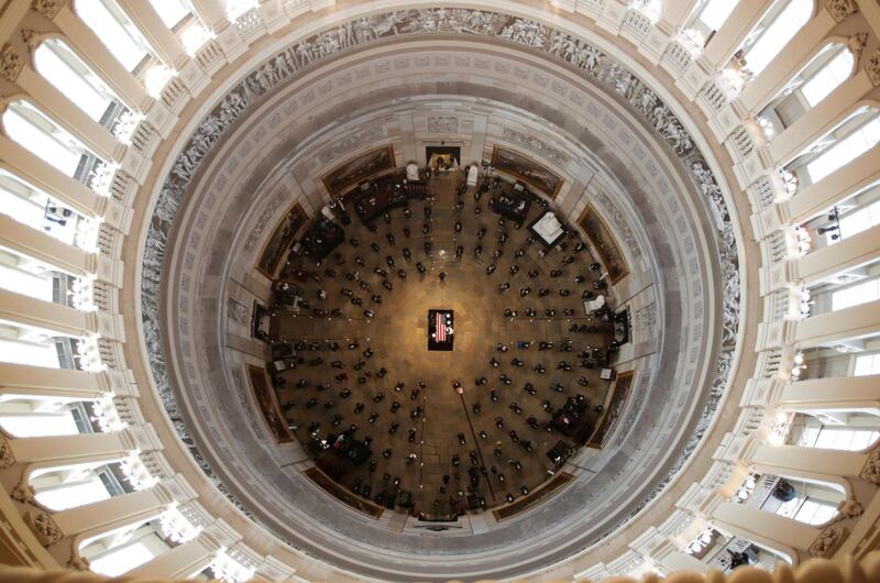 The casket of civil rights pioneer and longtime US Representative John Lewis, who died July 17, is placed by a USmilitary honor guard at the center of the US Capitol Rotunda to lie in state on July 27, 2020. Reuters