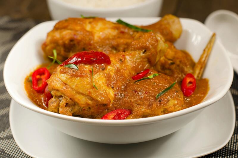 Malaysian ayam kapitan (Dh115), with tandoor roasted chicken with aromatic garlic, earthy ginger, and fresh red chilli. Photo: Punjab Grill