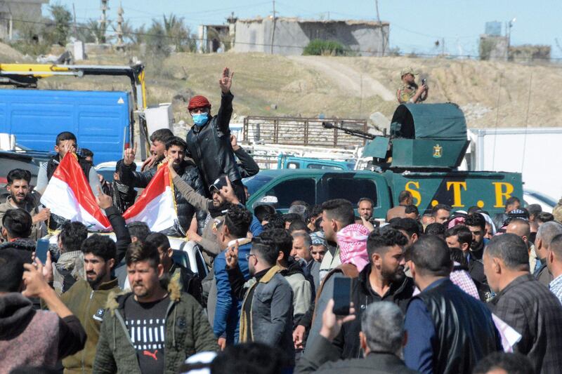 Iraqi mourners pray at the funeral of eight people killed in attacks claimed by ISIS. AFP