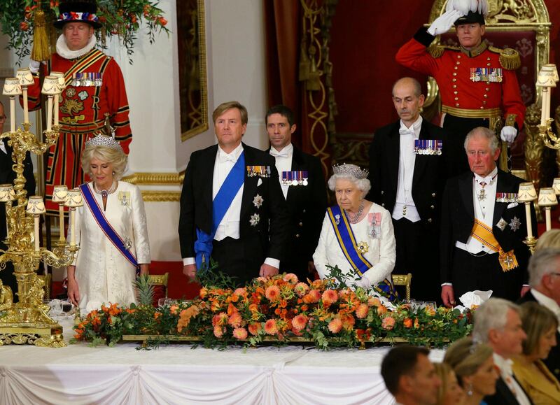 Camilla, Duchess of Cornwall, King Willem-Alexander of the Netherlands, Queen Elizabeth II and Charles, Prince of Wales attend a state banquet at the Buckingham Palace in London. Yui Mok / Reuters