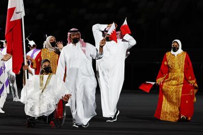 Rooba Alomari and Ahmed Meshaima of Bahrain lead their contingent during the opening ceremony. Reuters