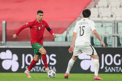 epa09094913 Portugal's Cristiano Ronaldo (L) fights for the ball with Azerbaijan's Badavi Guseynov during the FIFA World Cup Qatar 2022 Group A qualifier match Portugal against Azerbaijan in Turin, Italy, 24 March 2021.  EPA/MIGUEL A. LOPES