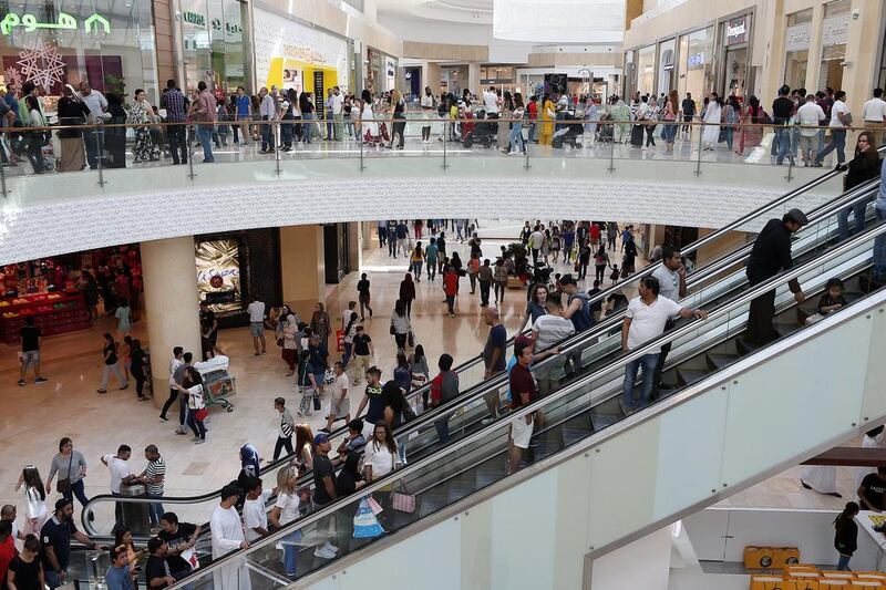 Above, shoppers during the 24-Hour Mega Sale at Yas Mall in Abu Dhabi. Extended opening hours over the Eid Al Fitr holiday, which marks the end to dawn-to-sunset fasting for Muslims, are common at malls in Dubai.