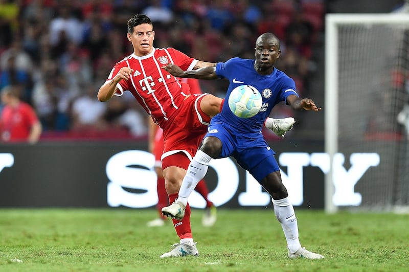 Bayern Munich's James Rodriguez and Chelsea's N'Golo Kante compete for the ball. Thananuwat Srirasant / Getty Images