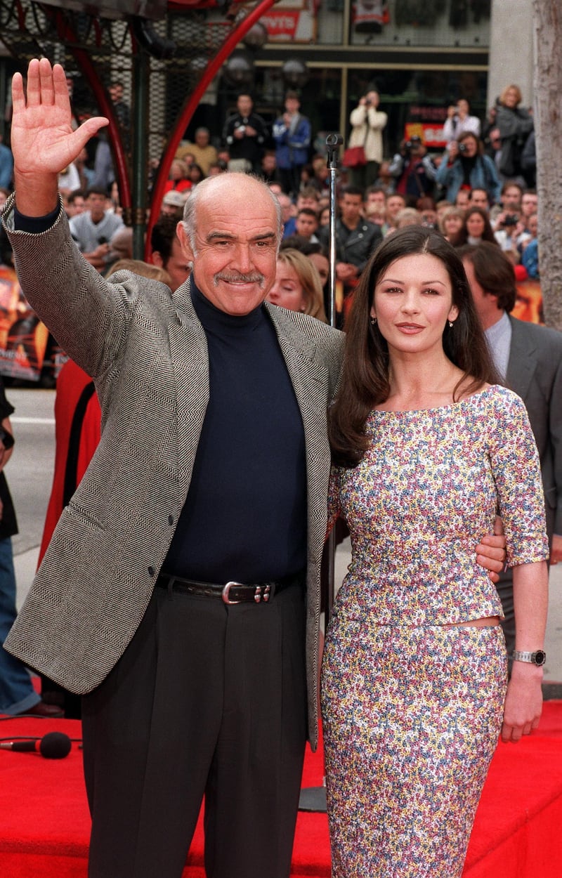 04/13/99. Hollywood, CA. Sean Connery and Catharine Zeta Jones at the Manns Chinese Theatre in Hollywood where Sean Connery had his handprints and footprints moulded in cement. Photo by DAN CALLISTER Online Usa Inc.