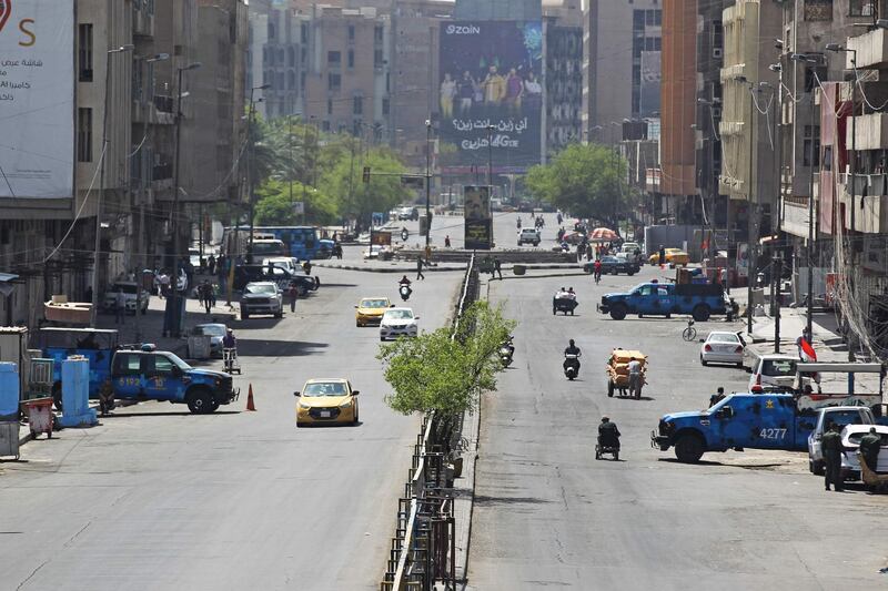 Iraqi security forces are deployed to enforce an extended curfew amid the pandemic, in Baghdad. AFP