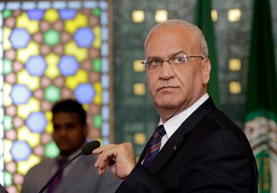 FILE - In this Aug. 11, 2014 file photo, Palestinian negotiator, Saeb Erekat, speaks during a news conference, following an emergency meeting at the Arab League headquarters in Cairo, Egypt.  The Palestinians threatened Saturday to suspend all communication with the Trump administration if it follows through with plans to shutter their diplomatic mission in Washington, dealing a potentially major blow to President Donald Trumpâ€™s hopes of securing an elusive Mideast peace deal. Erekat said the U.S. decision would undermine the peace process, calling the move â€œvery unfortunate and unacceptable.â€  (AP Photo/Amr Nabil)