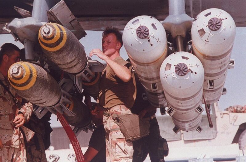 A USAF ground crew loading 500-pound bombs onto an aircraft during operation Desert Storm - the mission to drive Iraqi forces out of Kuwait, January-February 1991.  (Photo by Mark Peters/Department Of Defense (DOD)/The LIFE Picture Collection via Getty Images)