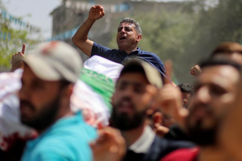 Mourners carry the body of Palestinian man Ahmed Al Shenbari during his funeral in the northern Gaza Strip. Reuters
