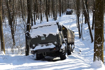 A column of Russian military vehicles abandoned in the snow near Kharkiv in March 2022. AFP