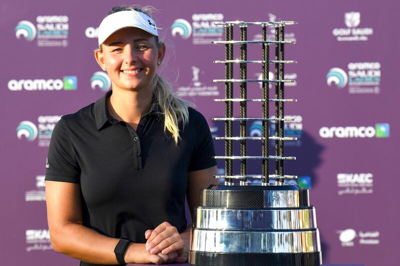 Danish golfer Emily Kristine Pedersen poses next to the trophy after winning the Saudi Ladies International. AFP