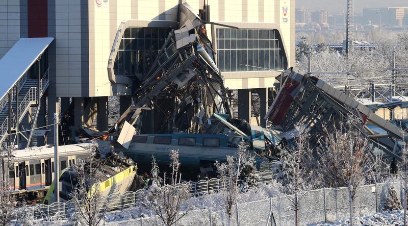 Firefighters try to rescue victims after a high speed train accident in Ankara. EPA