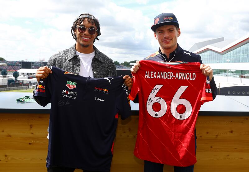 NORTHAMPTON, ENGLAND - JULY 03: Max Verstappen of the Netherlands and Oracle Red Bull Racing meets Trent Alexander-Arnold prior to the F1 Grand Prix of Great Britain at Silverstone on July 03, 2022 in Northampton, England. (Photo by Mark Thompson / Getty Images)