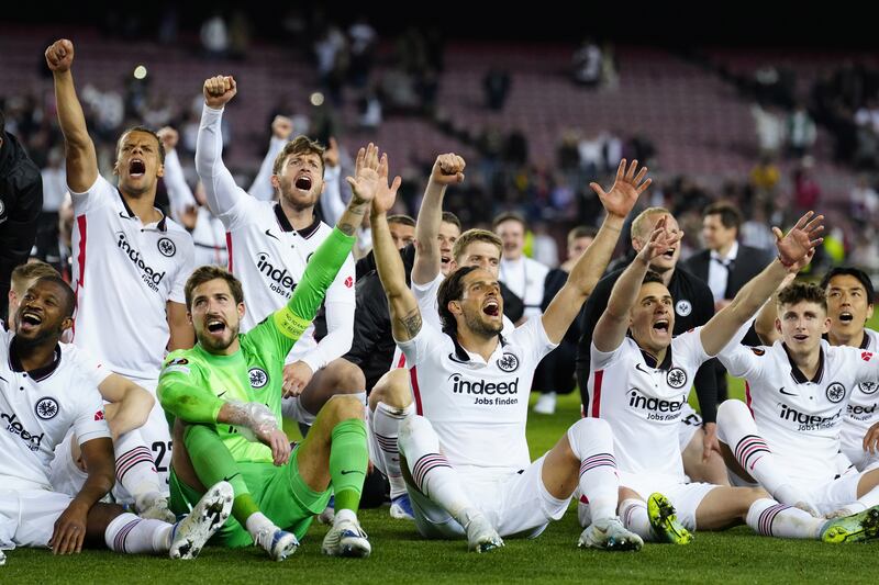 Eintracht Frankfurt players celebrate at the end of the Europa League quarter-final victory at Barcelona. EPA