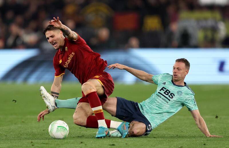 Nicolo Zaniolo of Roma is tackled by Jonny Evans of Leicester City. Getty Images