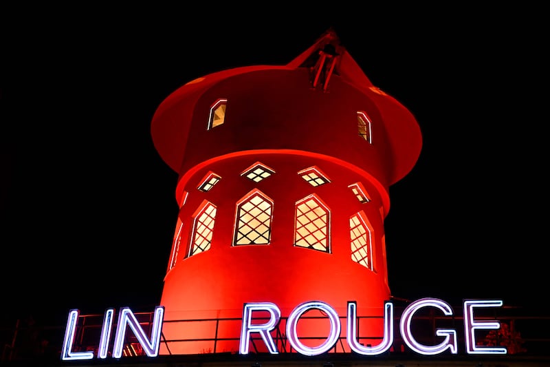 The Moulin Rouge in Paris, with its sign missing letters, a day after the sails of its windmill collapsed. While the reason for the accident was not yet known, the director of the cabaret nightclub said there was no sign of 'foul play', adding the cause was 'obviously a technical problem'. AFP