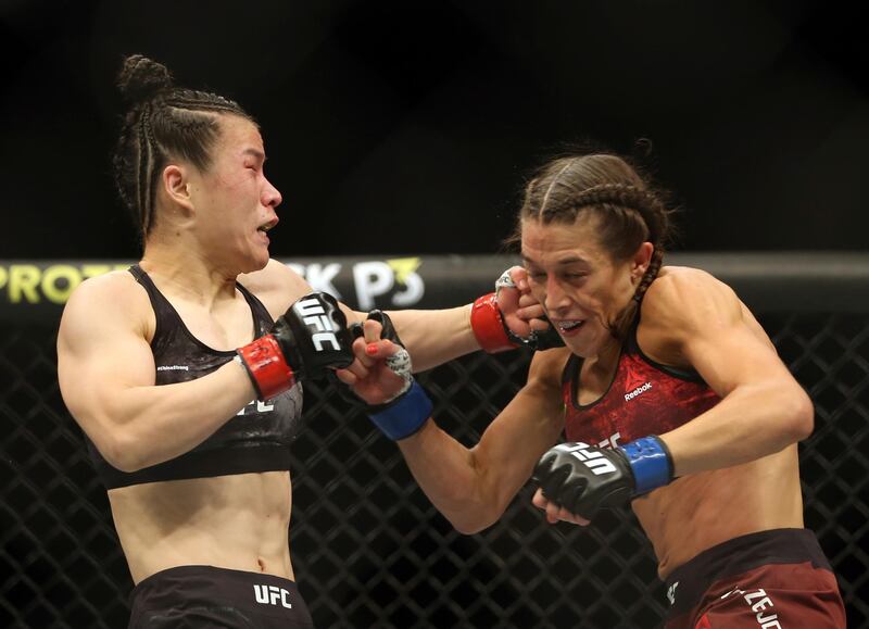 Weili Zhang and Joanna Jedrzejczyk trade blows during their title fight at UFC 248. AP Photo
