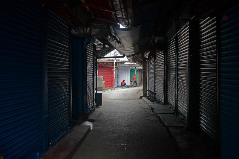 Partially deserted roads with closed shops are seen in a market in Siliguri. AFP