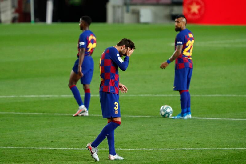 Barcelona's Gerard Pique, centre, reacts after the end of the match against Osasuna at the Camp Nou. AP