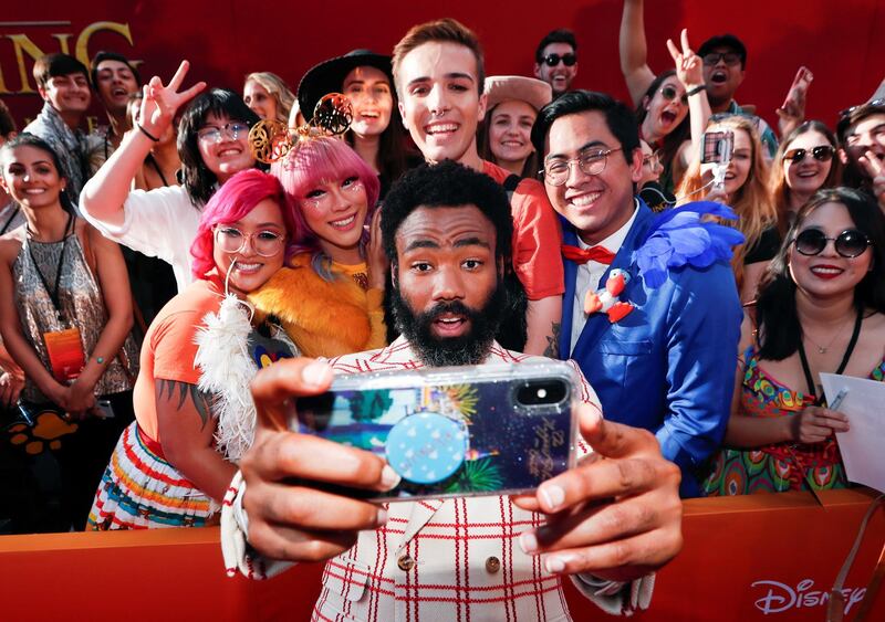 Donald Glover poses for a photo with fans during the world premiere of Disney's 'The Lion King' at the Dolby Theatre on July 9, 2019. Reuters