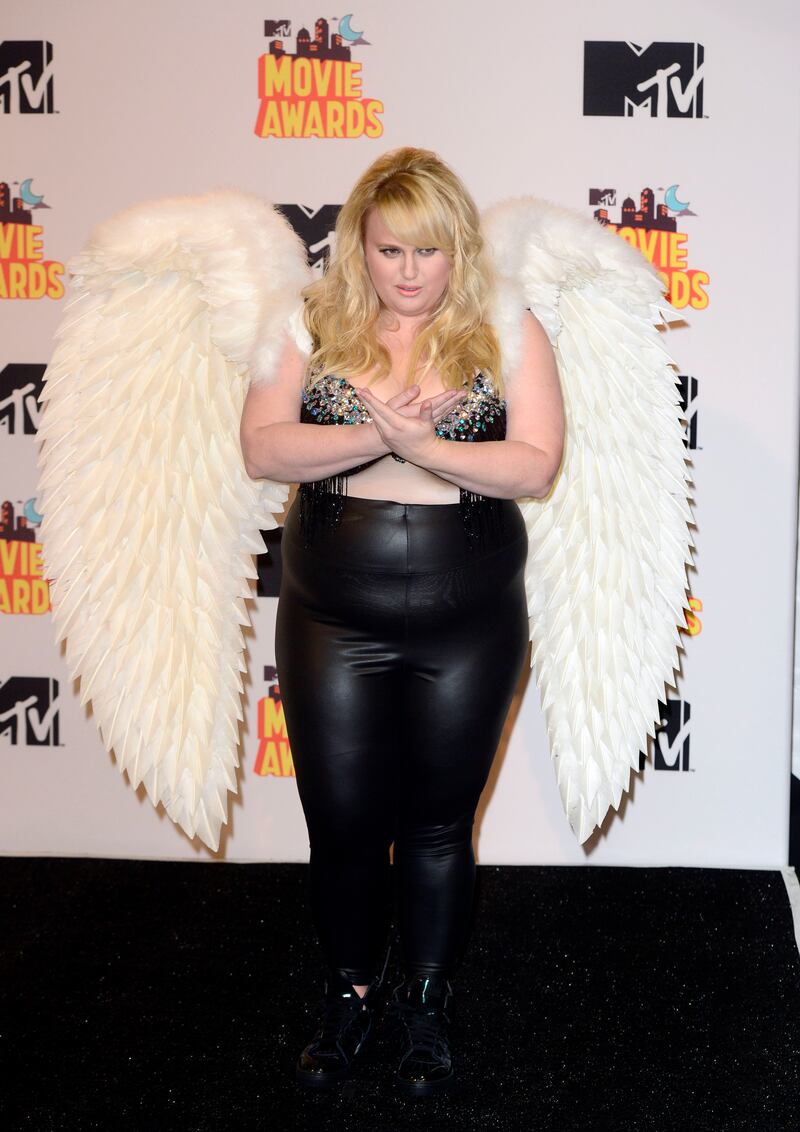 Rebel Wilson, wearing angel wings, a bralette and leather trousers, attends the MTV Movie Awards in Los Angeles, on April 12, 2015. EPA