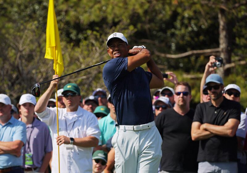 Tiger Woods hits his tee shot on the fifth tee during a practice round ahead of The Masters. Reuters
