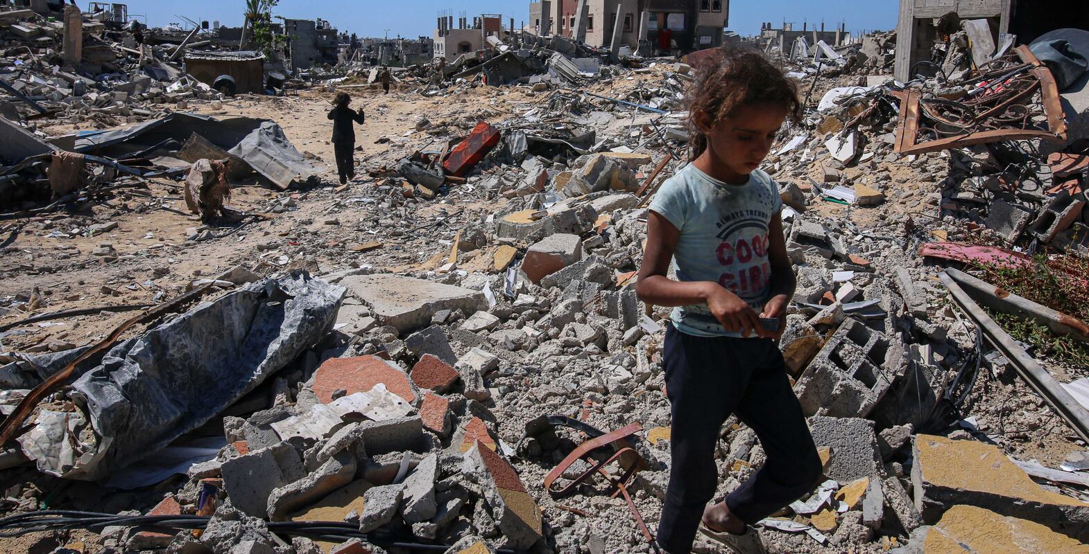 Displaced Palestinians inspect their destroyed homes after fleeing from Rafah, in central Khan Younis, Gaza, on Tuesday. Bloomberg