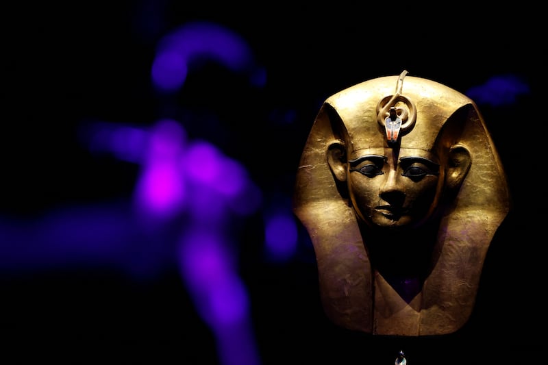 A gilded wooden mask from the coffin of Amenemope. Reuters