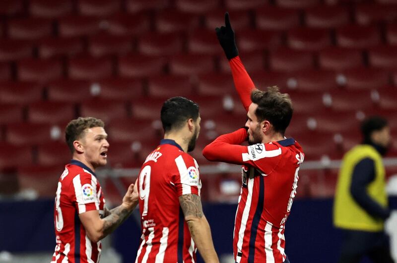 Atletico Madrid's midfielder Saul Niguez (R) celebrates with teammates after scoring the second goal. EPA