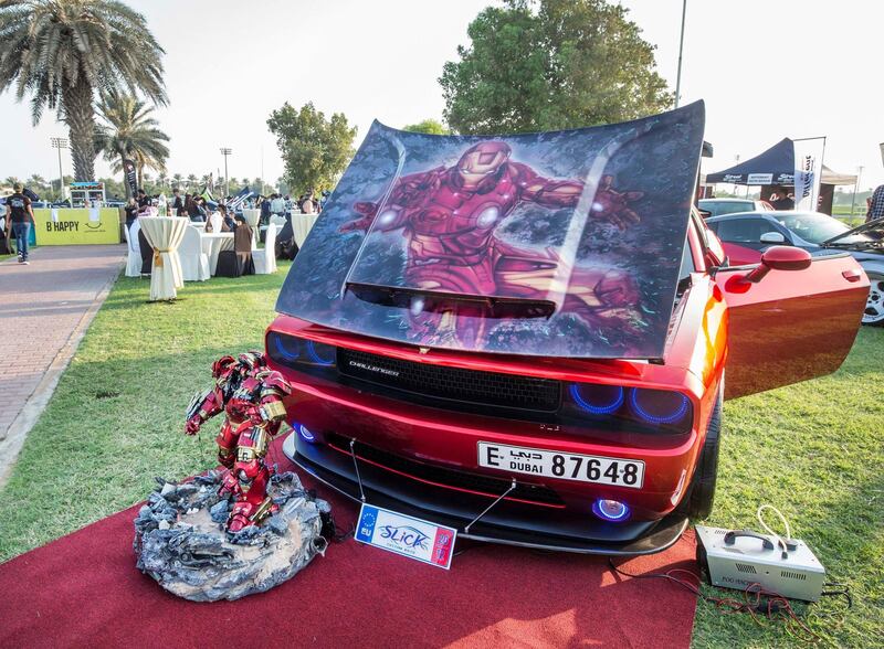 ABU DHABI, UNITED ARAB EMIRATES, 28 OCTOBER 2018 - A Dodge Challenger 2012 model LG Iron muscle car owned by Ihzone Perez at the Street Meet modified cars event, Abu Dhabi City Golf Club.  Leslie Pableo for The National for Adam Workman's story