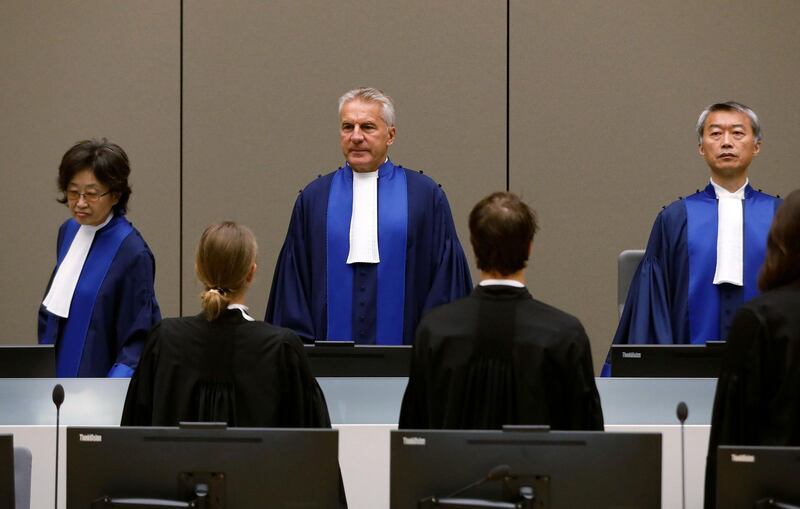 ICC Presiding Judge Robert Fremr (C) stands at the courtroom of the International Criminal Court (ICC) during the closing statements of the trial of former Congolese warlord Bosco Ntaganda in the Hague, the Netherlands, on August 28, 2018. - International judges will hear closing arguments on August 28, 2018 in the case against former Congolese warlord Bosco Ntaganda, accused of war crimes including using child soldiers and sex slaves in his rebel army. Once known as "The Terminator", Ntaganda faces 13 counts of war crimes and five counts of crimes against humanity for his role in a brutal civil conflict in the DR Congo's volatile east more than 15 years ago.
justice (Photo by Bas Czerwinski / ANP / AFP) / Netherlands OUT