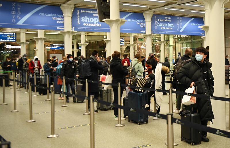 Travellers at Kings Cross St Pancras train station queue to board trains to Paris in London, Britain.  EPA
