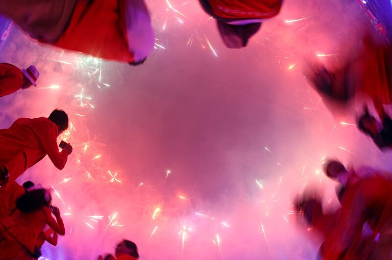 Athletes take pictures of fireworks during the Asian Games closing ceremony in Jakarta. Athit Perawongmetha/Reuters