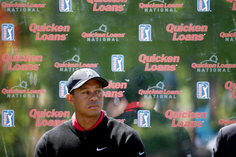 FILE - In this May 16, 2016, file photo, Tiger Woods pauses during a Quicken Loans National golf tournament media availability on the 10th tee at Congressional Country Club in Bethesda, Md. The tournament that Woods launched 10 years ago remained on next season's PGA Tour schedule. Still to be determined is where,  and if, it is held. The tour has opted out of its contract with Congressional next year as it tries to find a title sponsor. (AP Photo/Alex Brandon, File)