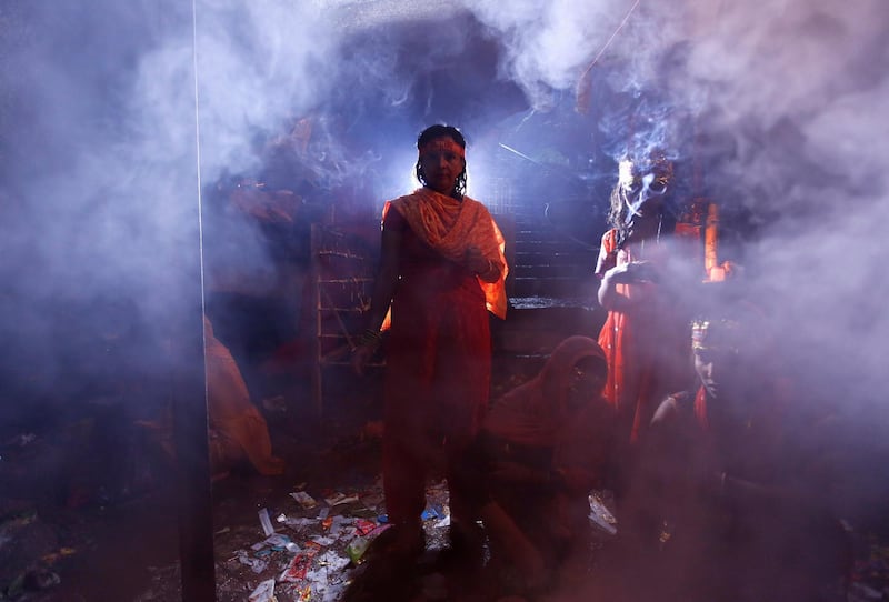 Smoke rises from burning incense as devotees perform religious ritual while taking part in the 'Bol Bom' pilgrimage in Kathmandu, Nepal. Navesh Chitrakar/Reuters
