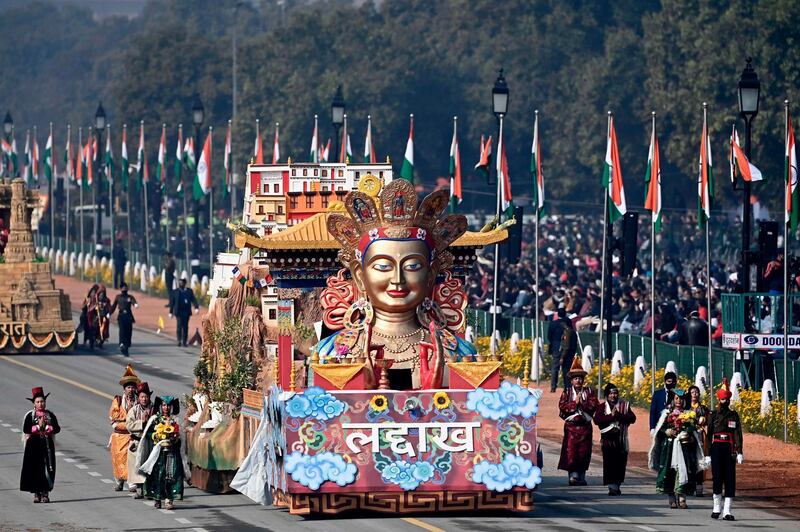 Performers dance next to a float representing Ladakh region on Rajpath during the Republic Day Parade in New Delhi. AFP