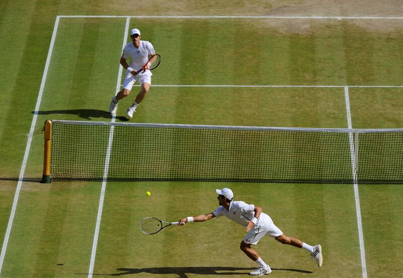 Novak Djokovic of Serbia, front, plays a return to Andy Murray of Britain during the Men's singles final match at the All England Lawn Tennis Championships in Wimbledon, London, Sunday, July 7, 2013. (AP Photo/Tom Hevezi, Pool) *** Local Caption ***  Britain Wimbledon Tennis.JPEG-0242f.jpg