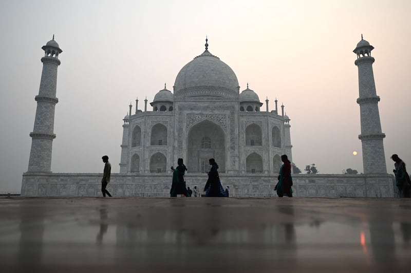 The Taj Mahal as the sun rises in Agra. AFP