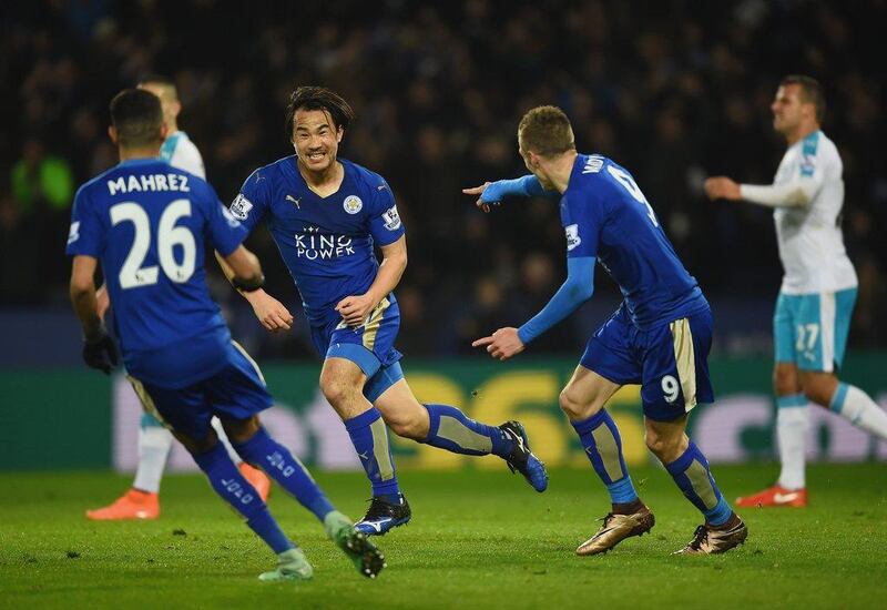 Shinji Okazaki of Leicester City (2L) celebrates with teammates as he scores their first goal with an overhead kick during the Premier League match between Leicester City and Newcastle United at The King Power Stadium on March 14, 2016 in Leicester, England. (Photo by Laurence Griffiths/Getty Images)